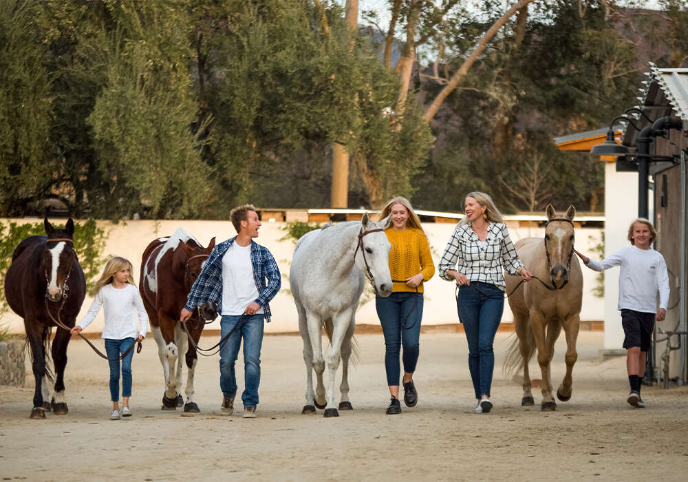 Hurtt family and their polo ponies (L to R)- Laine, Spencer, Lily, Molly, Logan. ©Izzy Anderson